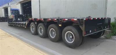 Hur påverkar lastvikten bromssträckan för ett fyraxligt transportfordon?